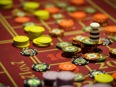 close-up of casino chips on the red table.